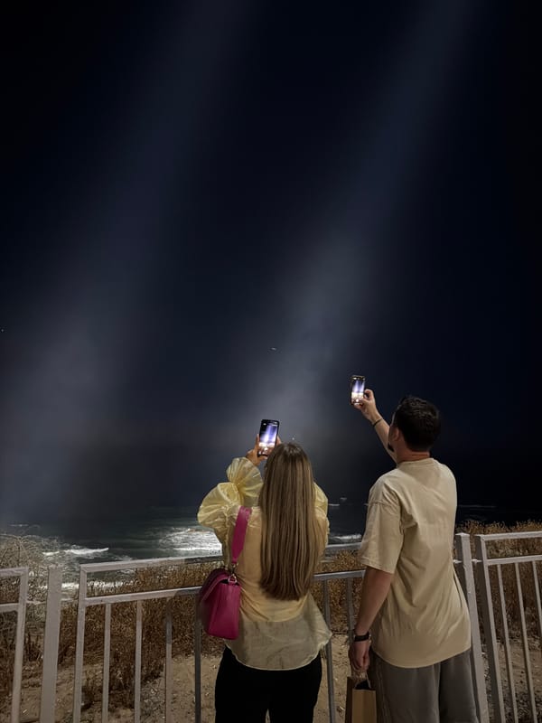 Foggy night on the Bat Yam coast, searchlights over the sea