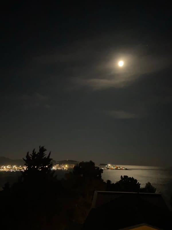 Nighttime coastal views documented in Šušanj, Montenegro under full moon