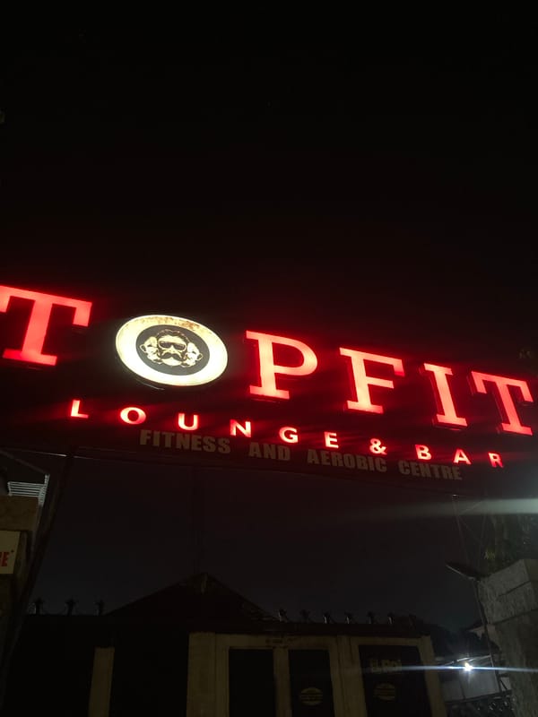 Neon-lit nightlife outside a Gwarinpa lounge bar
