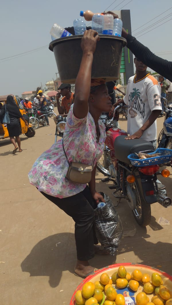 Busy street market documented in Ado, Nigeria during morning hours