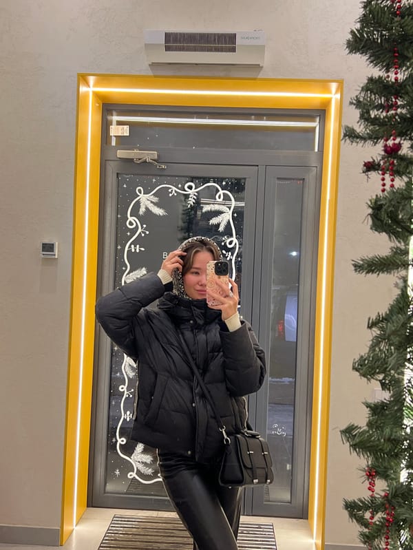 Woman documents cafe visit with selfies in Krasnoyarsk