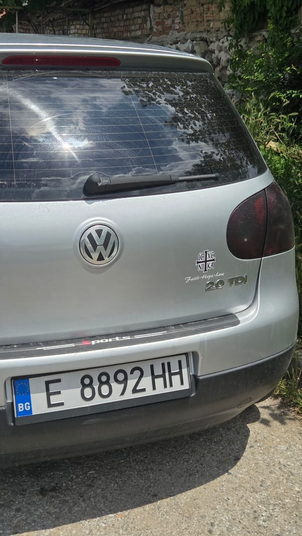 Quiet morning errands around a village, Volkswagen Golf in tow
