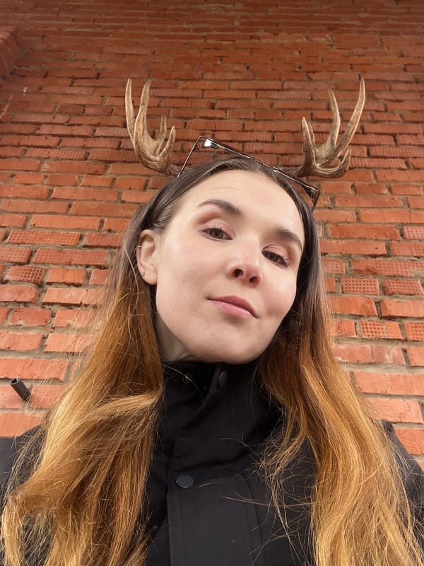 Woman relaxes in playground swing during spring morning in Votkinsk