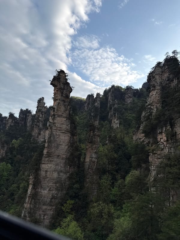 Visitor documents Zhangjiajie's iconic sandstone pillars and cable cars