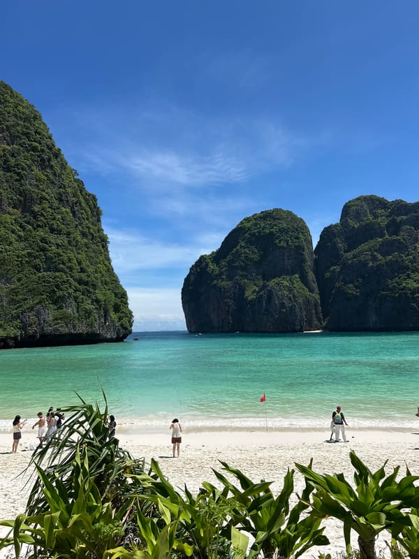 Tourists explore Maya Bay boardwalks and beaches in Thailand