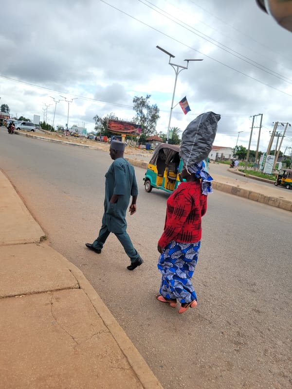 Morning street life and construction activity in Jos, Nigeria