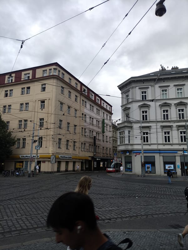 Trams and cobblestones on a cloudy Prague afternoon