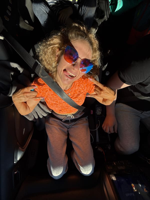 Woman in orange shirt observed in car in Chaikovsky