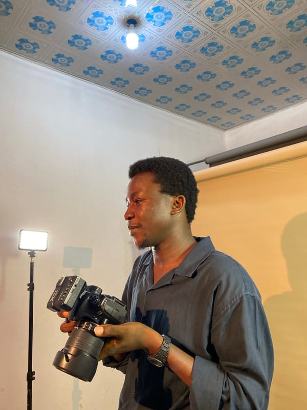 Portrait photography session in makeshift studio, Gura Top Nigeria