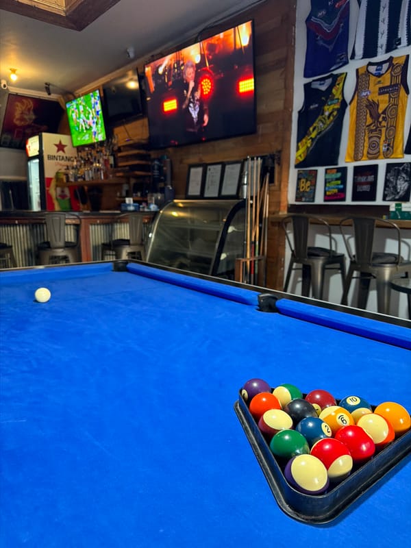 Kuta bar interior with pool table and batik décor