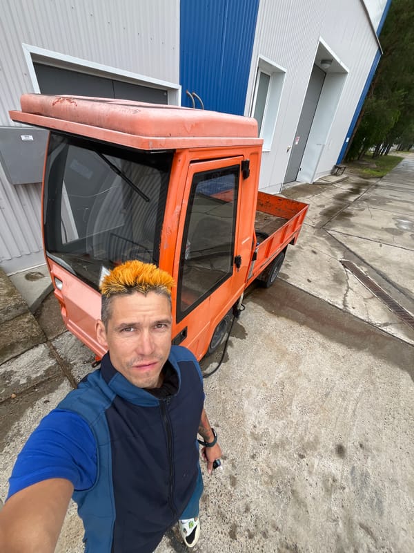 Selfies with an orange utility vehicle in Chaikovsky, Russia