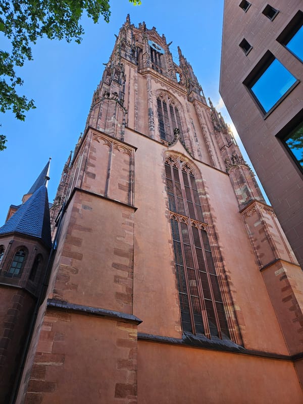 Frankfurt Cathedral photographed from low angle amid modern architecture