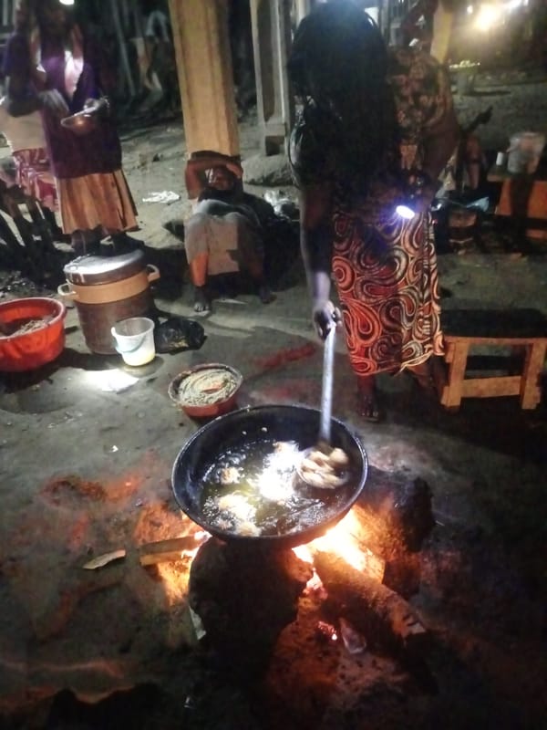 Nighttime communal cooking scene documented in Keffi, Nigeria