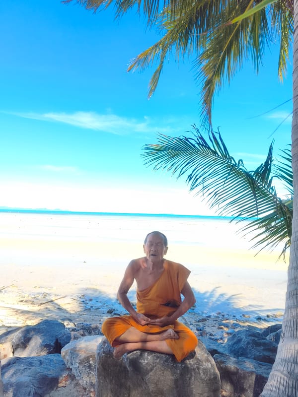 Morning with a monk at a beachside temple in Nathon