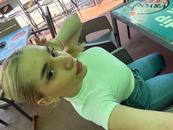 Woman takes morning selfies at Sofia cafe