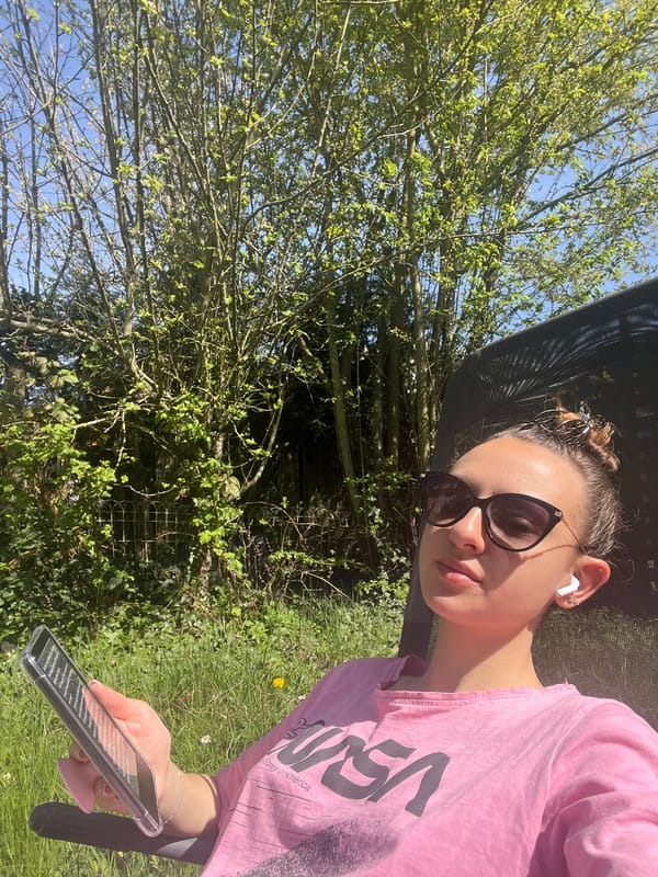 Woman in pink NASA shirt enjoys afternoon in Saarbrücken