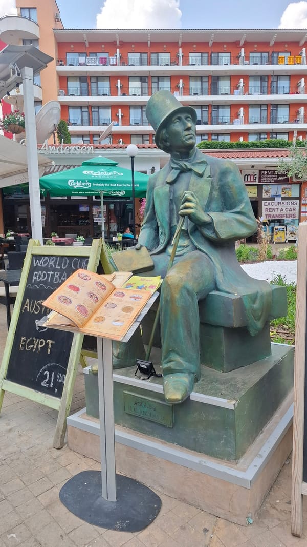 Summer morning around a Nesebar resort: statues, seagulls, and garden scenes