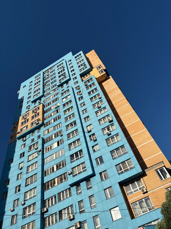 Mytishchi streets, churches, and apartment towers on a sunny afternoon