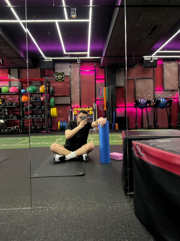 Person exercises with foam roller at Sofia fitness facility
