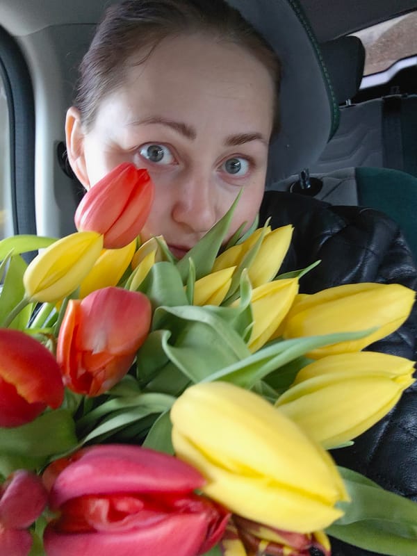 Woman photographed with tulips in early morning Markovo portraits