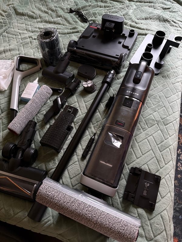 Cordless vacuum components displayed on bed in Moscow