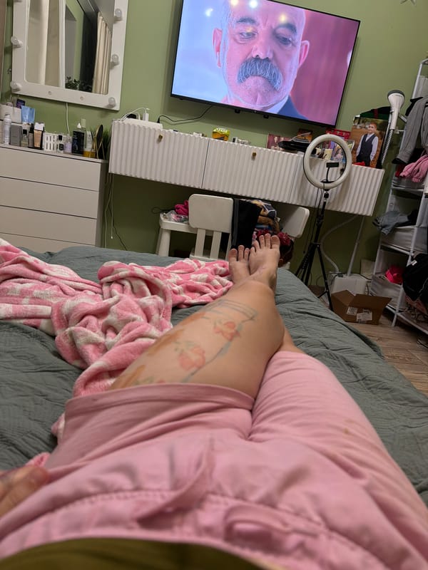Evening TV time in a green-walled bedroom, Zavetny