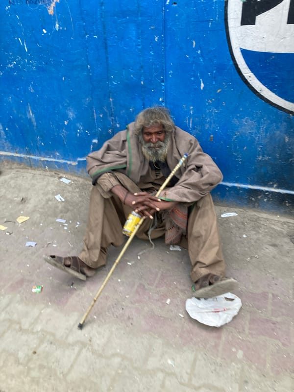 Street scenes captured in Quetta show cart puller, seated man