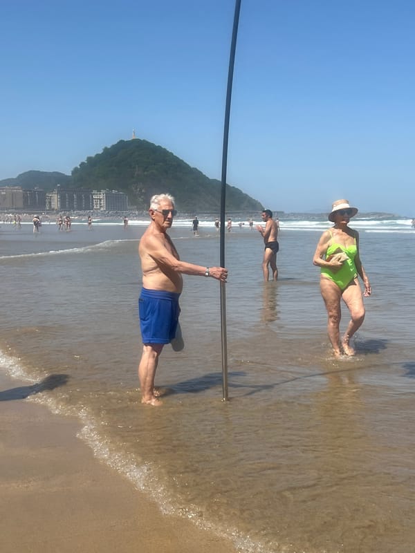 Lifeguard patrol and beachgoers at La Concha beach morning