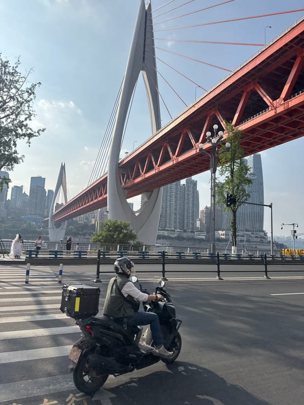 People gather near Dongshuimen Bridge walkway in Chongqing