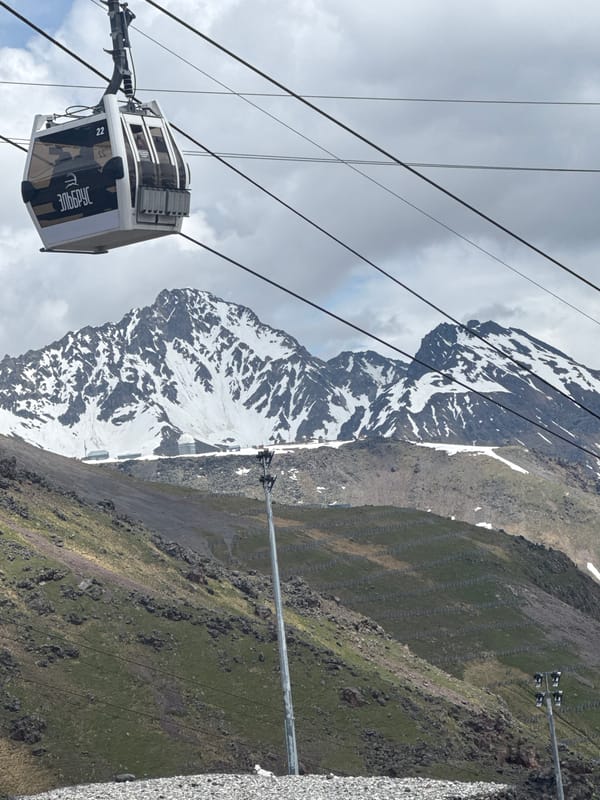Riding the Elbrus cable car through rugged alpine terrain