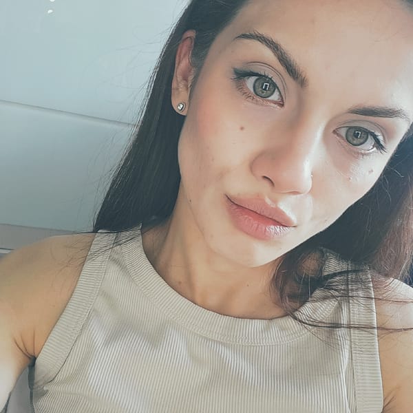 Close-up selfie series in Moscow, ribbed tank top and tattoo visible.