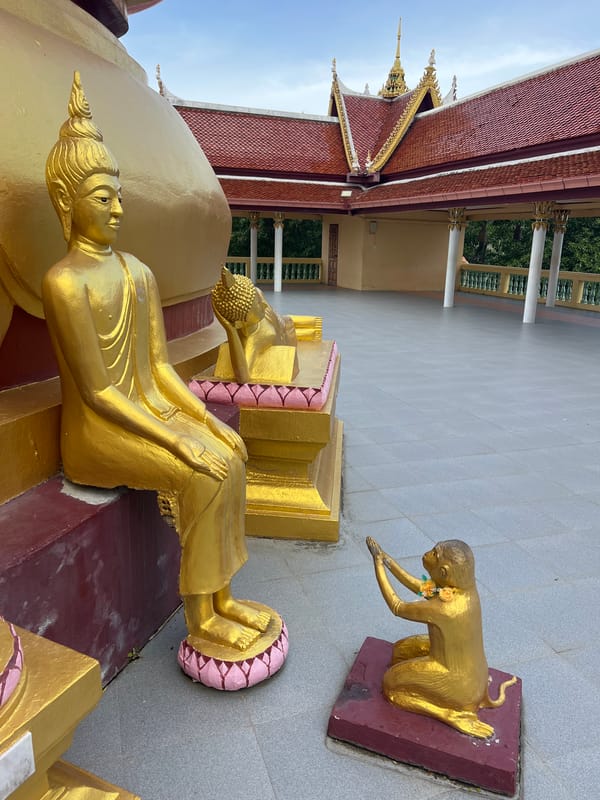 Golden Buddha statue at Ko Samui temple, multiple angles