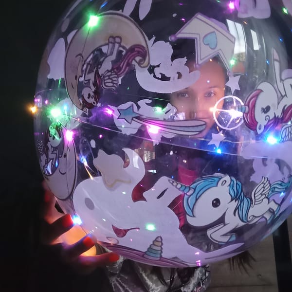Woman plays with LED lights in Pervomaysky, Russia