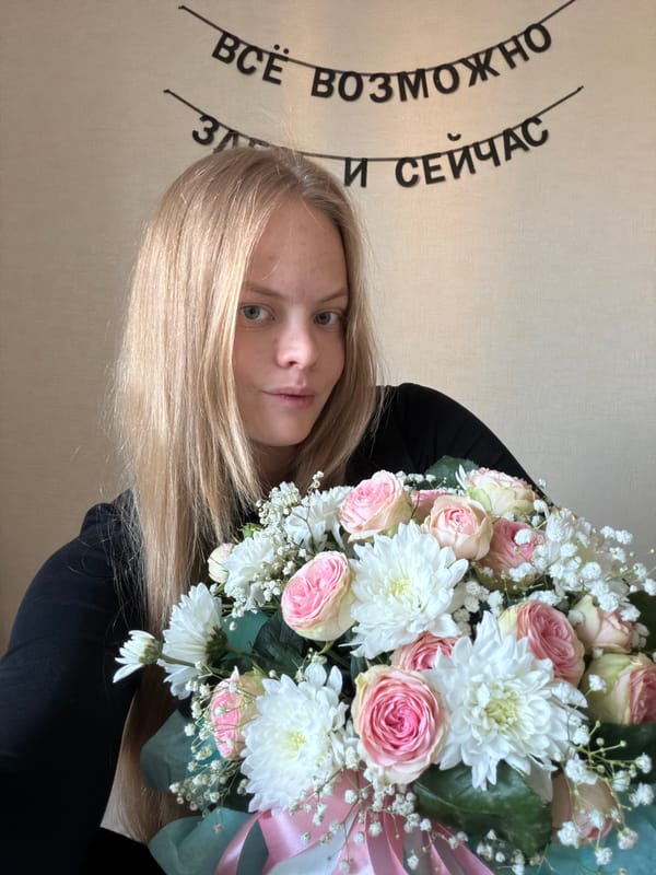 Woman photographed with flower bouquet in Izhevsk, Russia