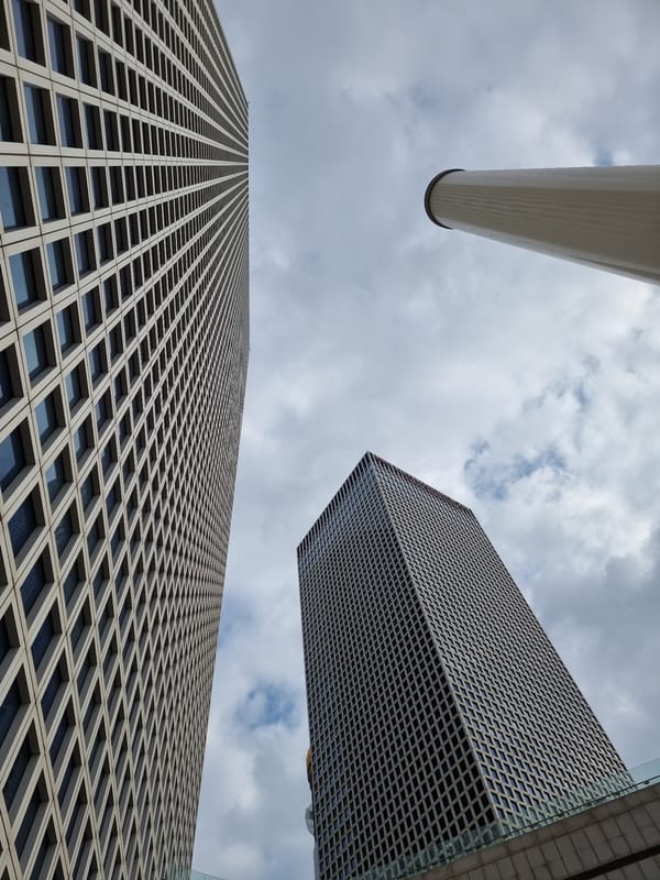 Architectural structures photographed against cloudy sky in Tel Aviv