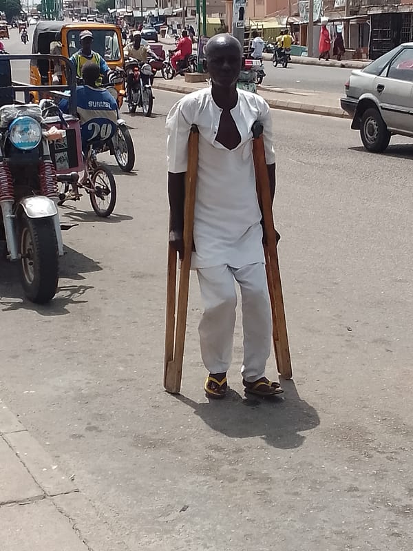 Daily street life documented in Nigerian towns during midday