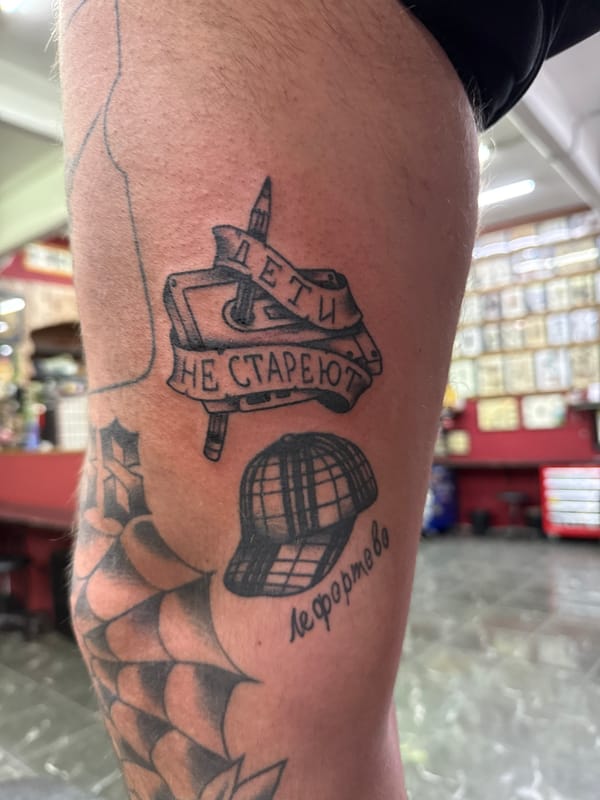 Tattoo session documented in Moscow studio showcases multiple arm designs