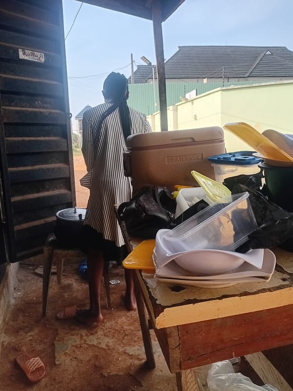 Person stands by laden wooden table in Ikorodu, Nigeria