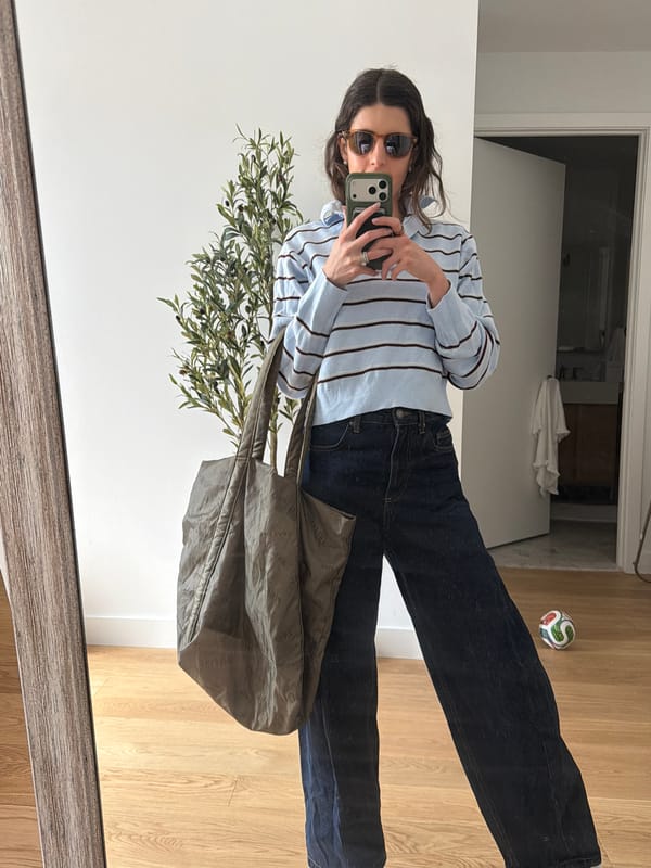 Woman takes mirror selfie with green phone case in New York