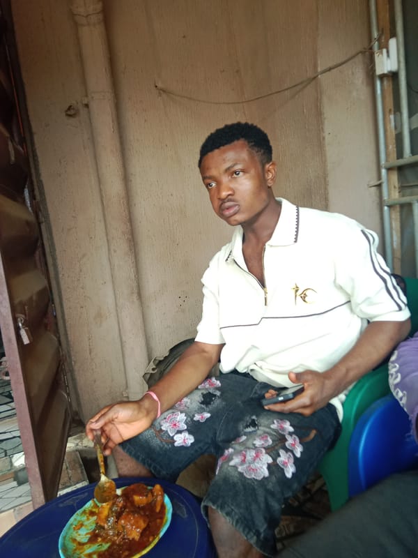 Young man observed eating in casual setting