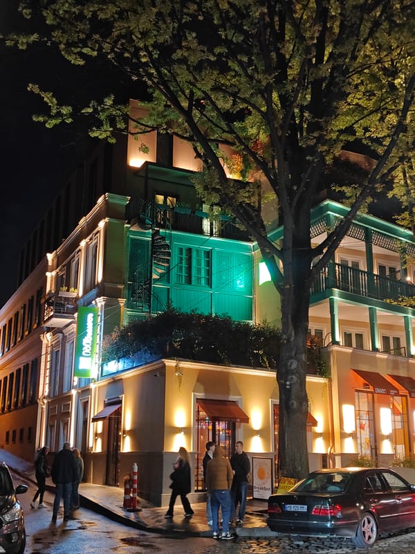 Evening street scenes captured in illuminated Tbilisi district