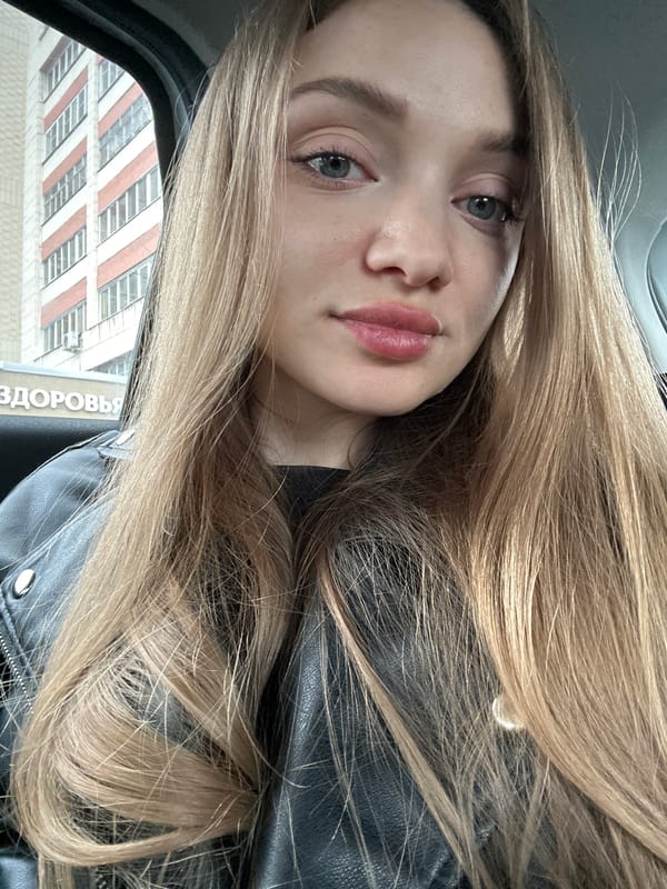 Woman takes selfie in black leather jacket in Kazan