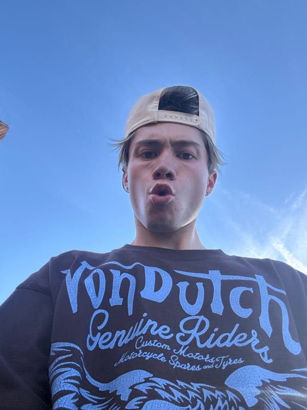 Person takes selfies at outdoor event in La Quinta