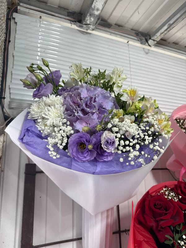 Elaborate flower arrangements documented in Kamianske flower shop display