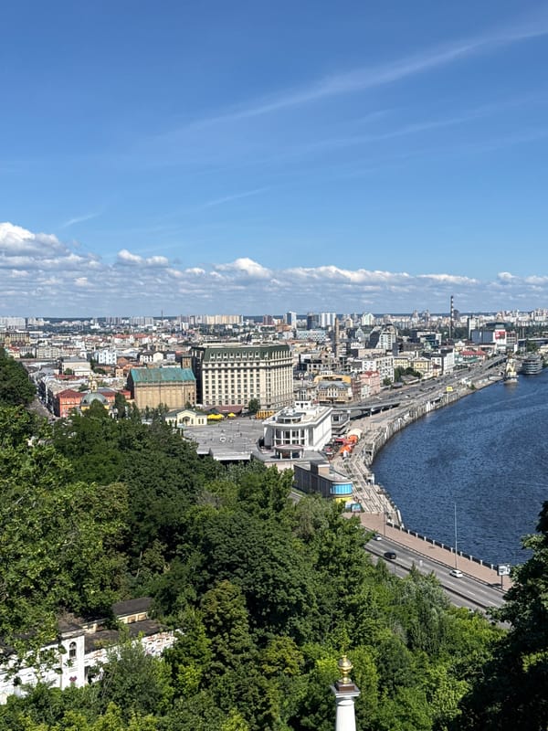 Kyiv landmarks, war memorials, and riverside views on a sunny morning