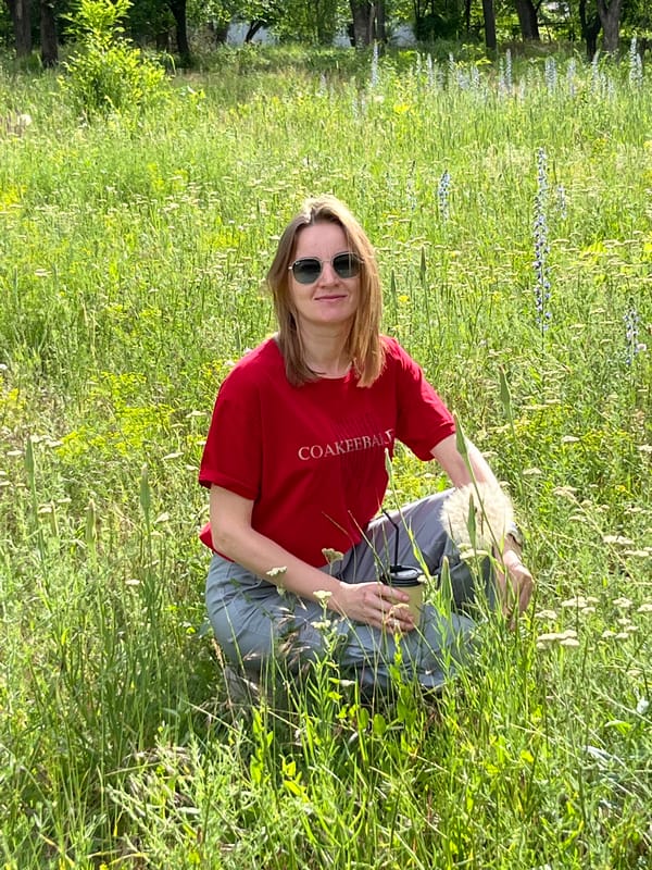 Woman enjoys coffee break in wildflower field near Kryvyi Rih