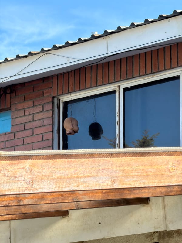 Doll's head spotted hanging in Ushuaia building window