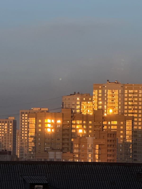 Yekaterinburg apartment buildings glow golden at twilight