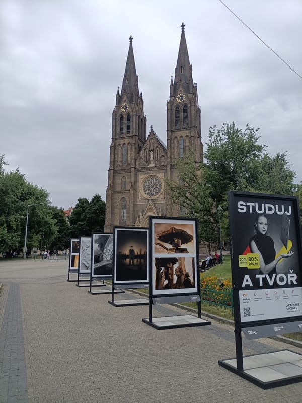 Prague streets, trams, and Vyšehrad basilica on a cloudy afternoon