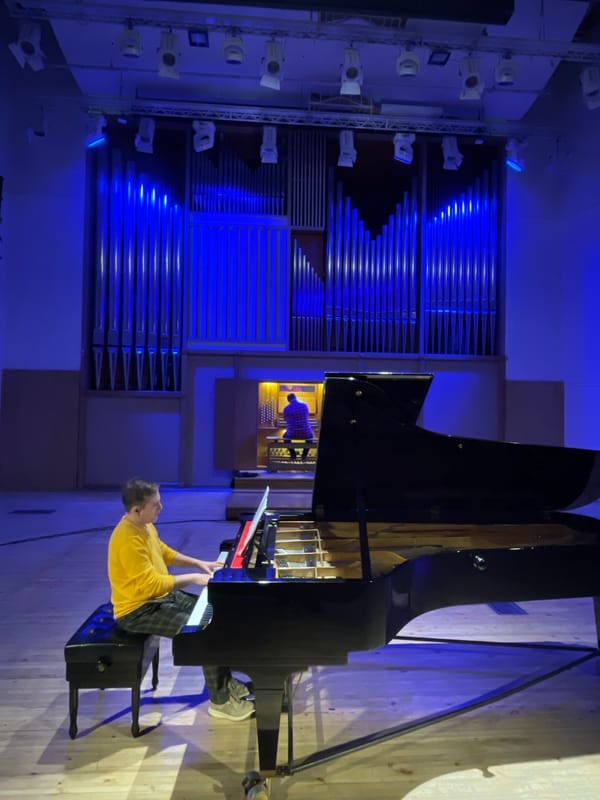 Musical instruments and cityscape observed in Yekaterinburg afternoon